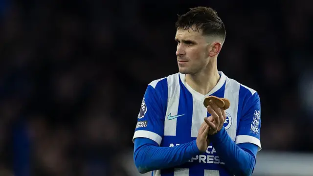 Pascal Gross of Brighton & Hove Albion applauds the fans