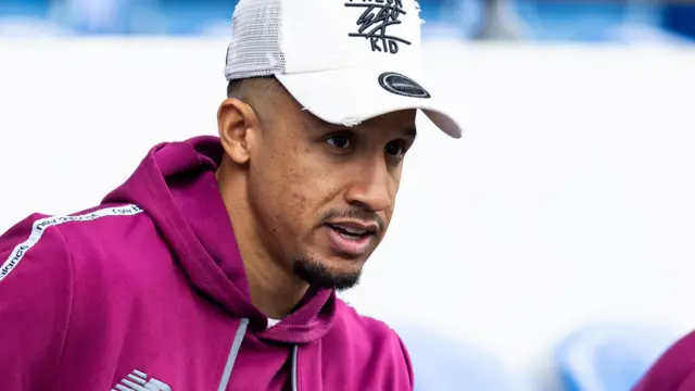 Callum Robinson watches a game at Cardiff City Stadium