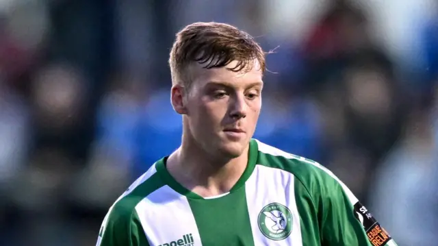 Cian Doyle playing for Bray Wanderers in a green-and-white-striped kit