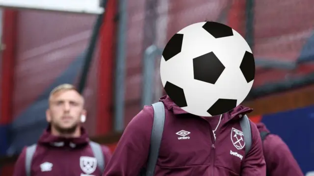 West Ham player hidden behind a football with Jarrod Bowen walking behind 