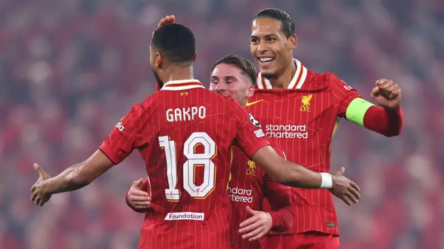 Virgil van Dijk and Cody Gakpo celebrate a goal for Liverpool