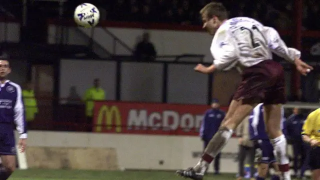 Robert Tomaschek heads Hearts' winner against Dundee