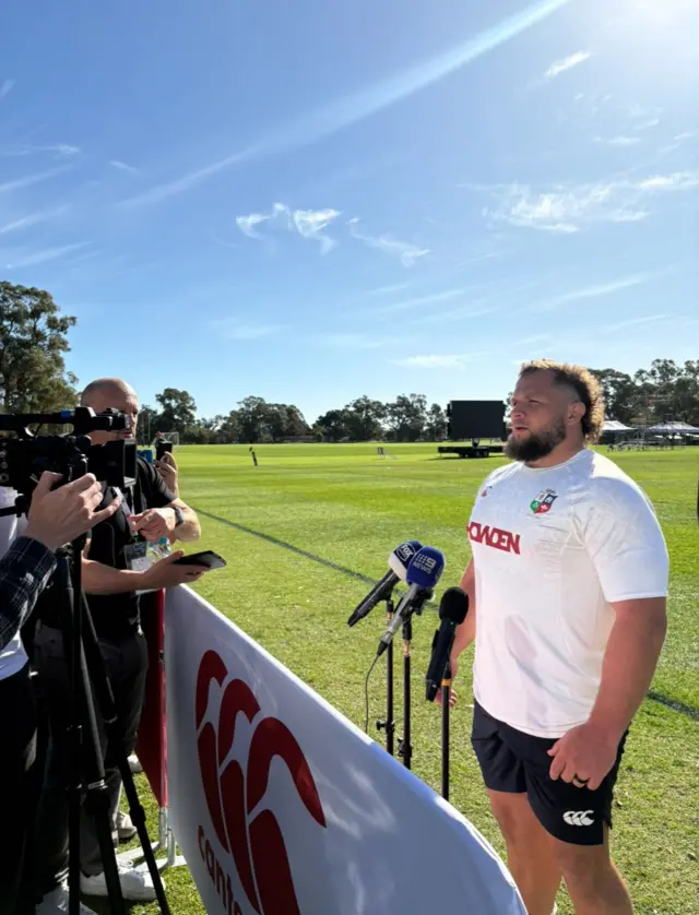 Pierre Schoeman stands in front of a microphone