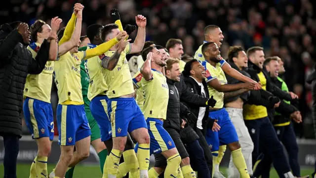 Southampton's players and staff celebrate as they beat Arsenal to progress in the FA Cup