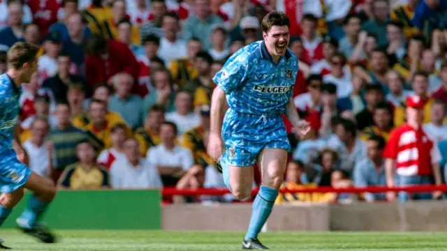 Mick Quinn celebrates after scoring a goal for Coventry City