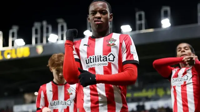 Southampton's Nick Oyekunle celebrates with a team-mate in background on either side
