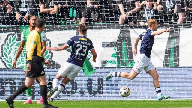 Scott Tiffoney runs off in celebration after giving Dundee the lead against Hibernian at Easter Road