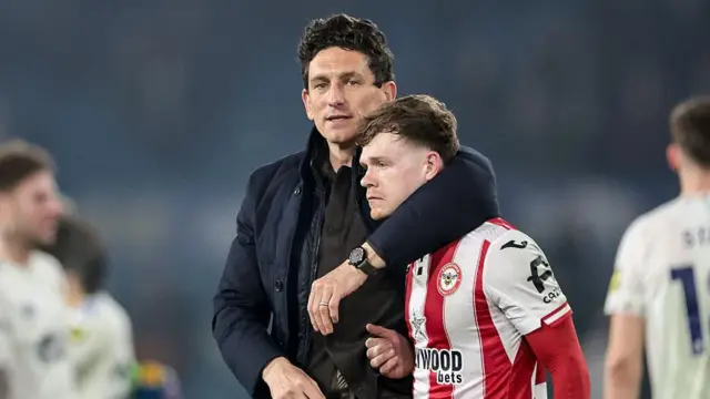 Keith Andrews, manager of Brentford, embraces Keane Lewis-Potter