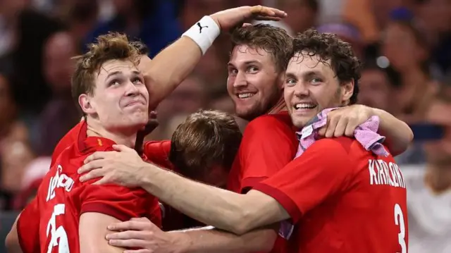 Denmark celebrate after beating Germany in the men's Olympic handball final in Paris