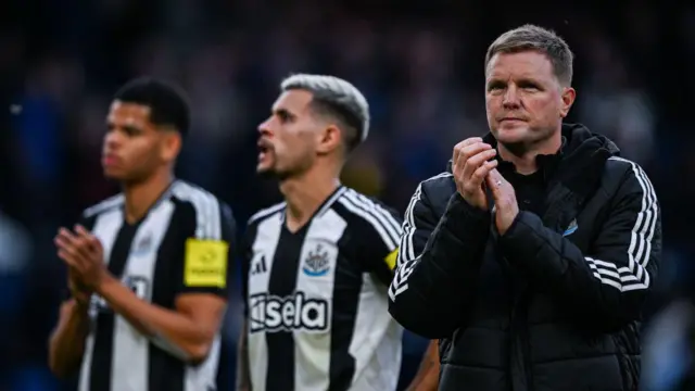 Newcastle boss Eddie Howe applauds supporters after the loss at Chelsea