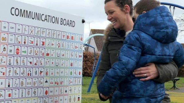 Lyme Regis communication boards aim to help non-verbal visitors - BBC News