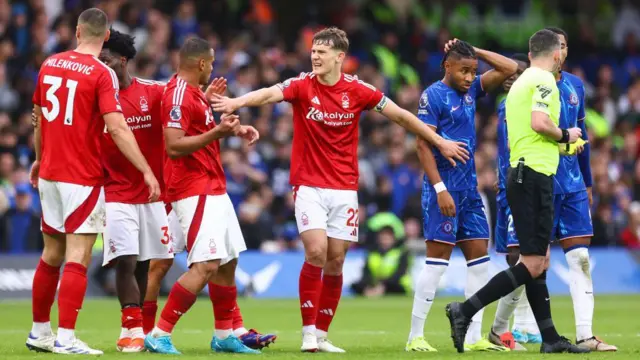 Ryan Yates of Nottingham Forest holds back teammate Murillo