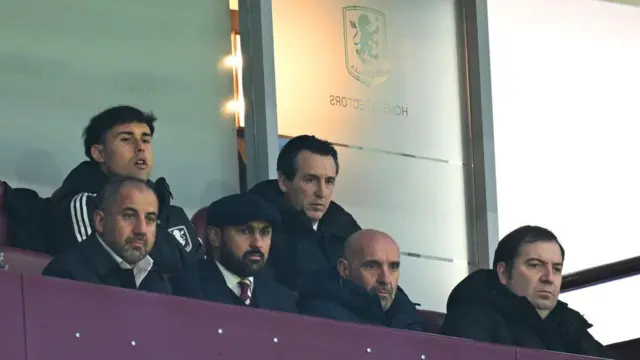 Unai Emery watches the match while sitting in the stand