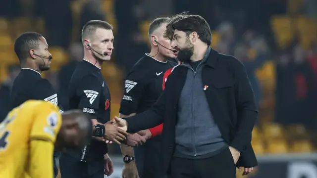 Rusell Martin talks to the referees after defeat against Wolves