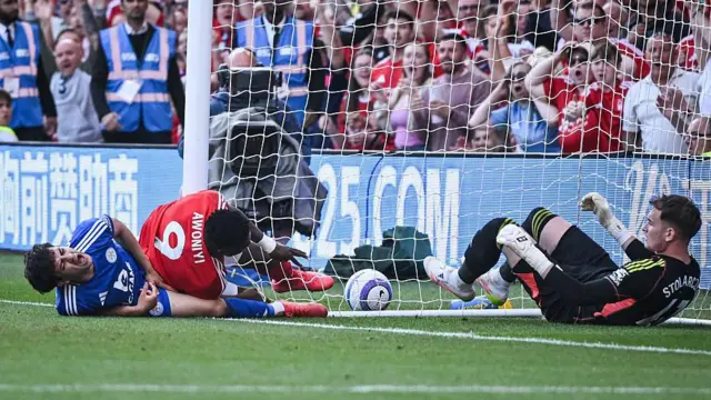 Taiwo Awoniyi collides with a post