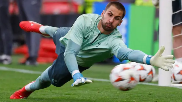 Alfie Whiteman stretches for a ball in training