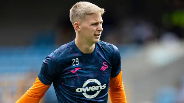 Nathan Broome warms up at Swansea