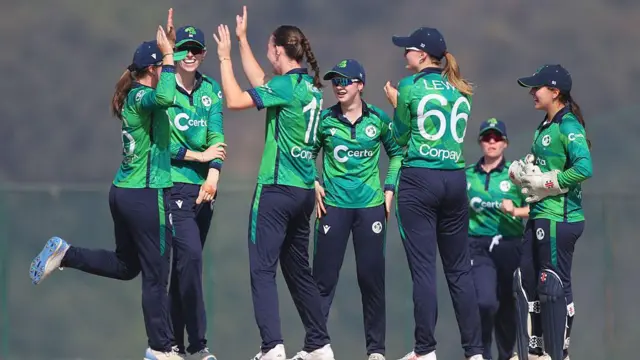 A group of Ireland players celebrate their win over the Netherlands in Nepal