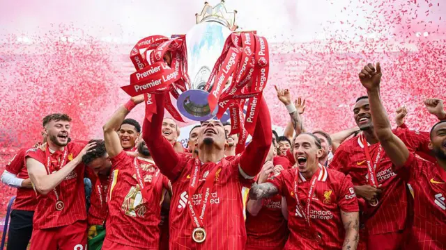 Liverpool players lift Premier League trophy