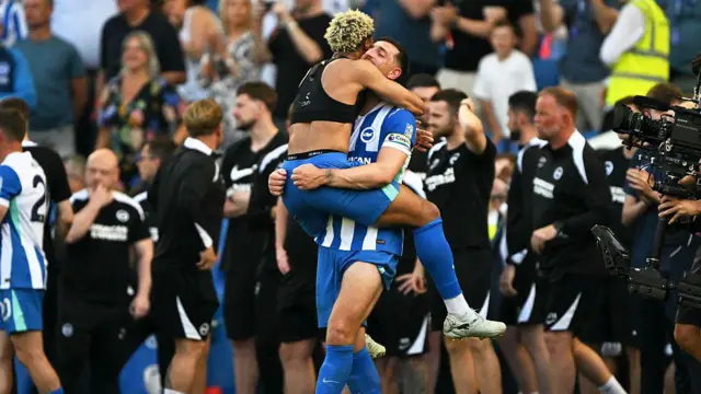 Brighton players Georginio Rutter and Lewis Dunk celebrate after securing European football