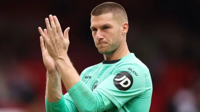 Sam Johnstone applauding fans after his debut for Wolves