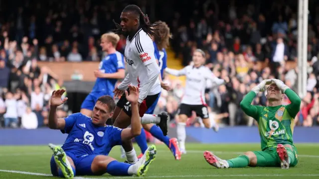 Alex Iwobi of Fulham celebrates scoring his team's second goal during the Premier League match between Fulham FC and Leicester City FC at Craven Cottage