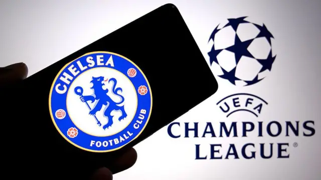 Chelsea badge displayed on a smartphone with Champions League logo in the background
