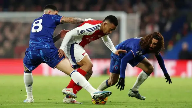 Enzo Fernandez, Gabriel Jesus and Marc Cucurella compete for the ball