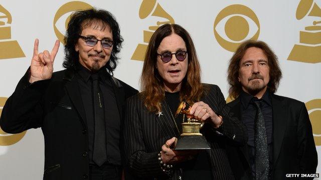 Tony Iommi with Ozzy Osbourne and Geezer Butler of Black Sabbath