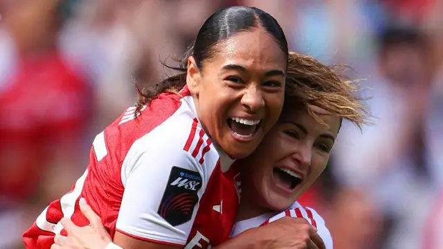 Olivia Smith (left) celebrates scoring for Arsenal