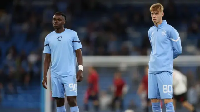  Romeo Lavia and Cole Palmer warm up before a Manchester City Champions Youth League game