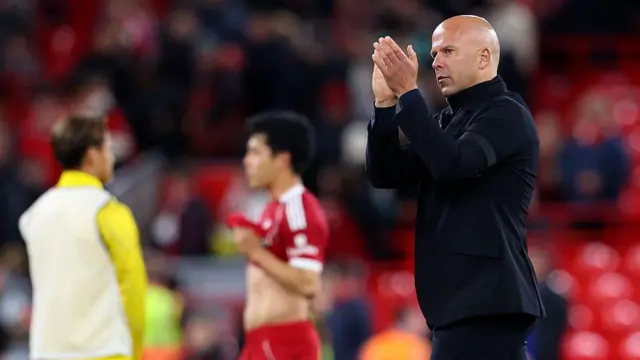 Arne Slot applauds the Liverpool fans