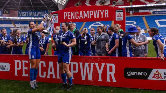 Cardiff players lifting the Adran Premier trophy last season