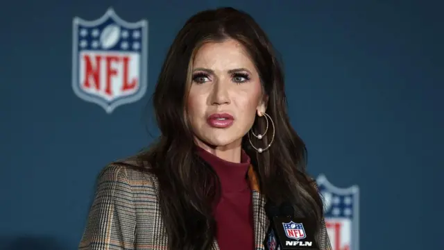 US homeland security secretary Kristi Noem speaking at an NFL news conference