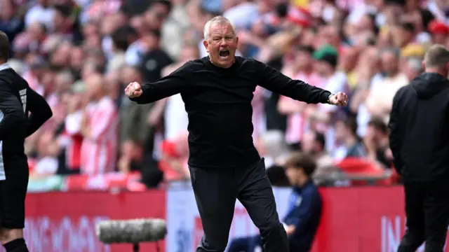 Chris Wilder celebrates Sheffield United scoring in their Championship play-off final against Sunderland