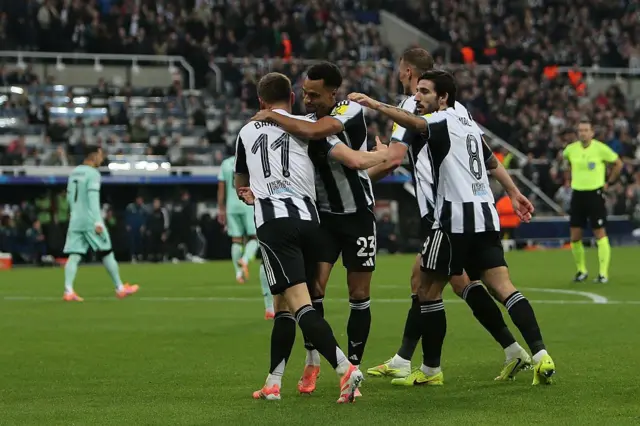 Harvey Barnes of Newcastle United is congratulated by his teammates.