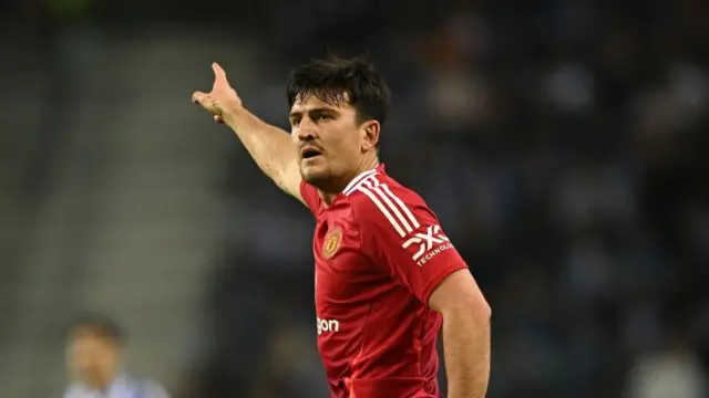 Harry Maguire gives instructions during match