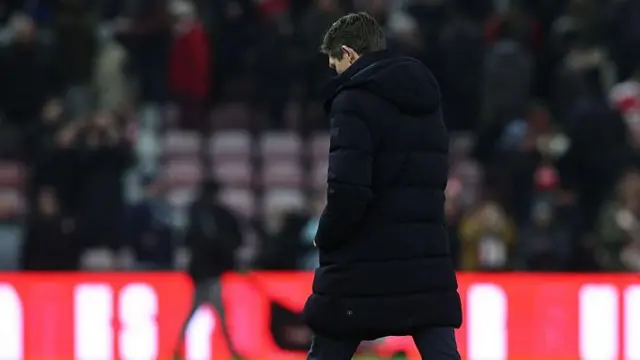 Oliver Glasner with his head down walking away