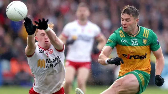 Conor O'Donnell in action against Seanie O'Donnell