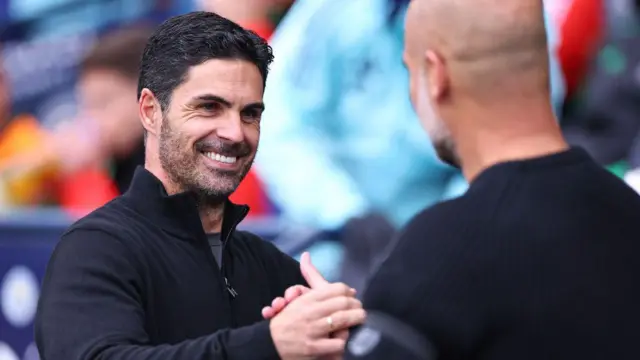 Mikel Arteta and Pep Guardiola shake hands ahead of Manchester City v Arsenal