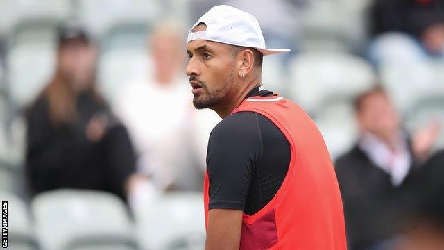 Nick Kyrgios looks to the side on court