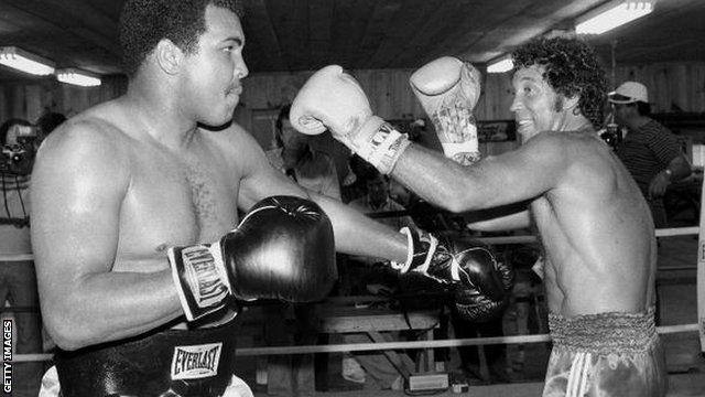 Muhammad Ali spars with Sir Tom Jones