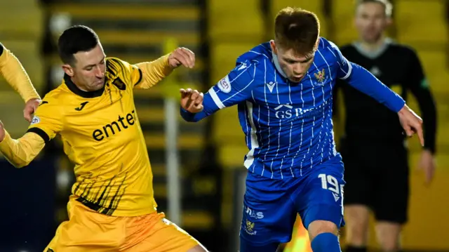 Livingston's Jason Holt (L) and St Johnstone's Luke Robinson in action during a cinch Premiership match between Livingston and St Johnstone at Tony Macaroni Arena, on December 27