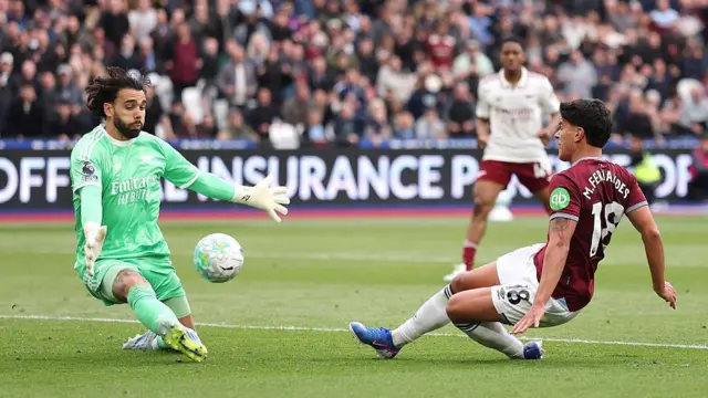 David Raya makes a save from Mateus Fernandes
