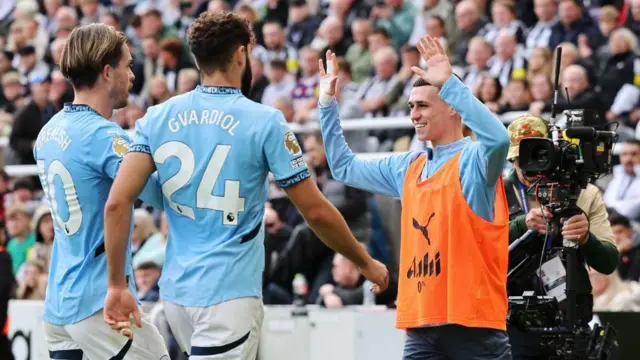 Josko Gvardiol of Manchester City celebrates scoring his team's first goal with teammates Jack Grealish and Phil Foden during the Premier League match between Newcastle United FC and Manchester City FC at St James' Park