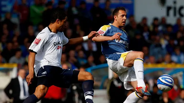 Michael Chopra (R) in action for Cardiff City against Swansea City's Ashley Williams (L) in 2009