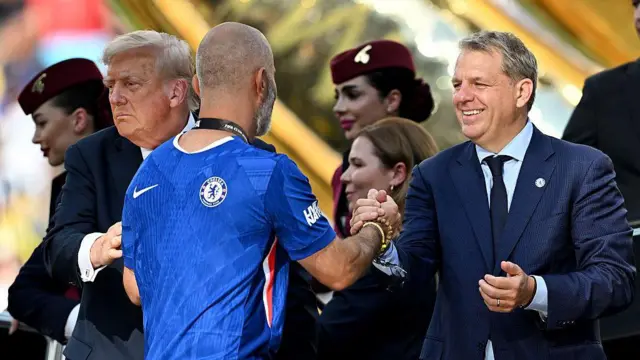 Todd Boehly congratulates Enzo Maresca during the award ceremony following the Club World Cup final