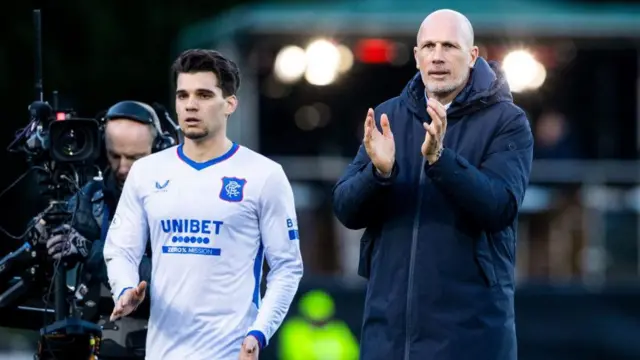 Philippe Clement applauds visiting fans at full-time