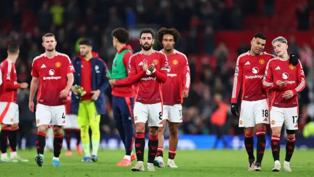 Dejected players of Manchester United at full time during the Premier League match between Manchester United FC and Chelsea FC at Old Trafford