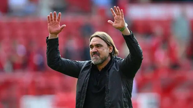 Daniel Farke gesturing towards Leeds fans with his arms in the air after the win at Nottingham Forest